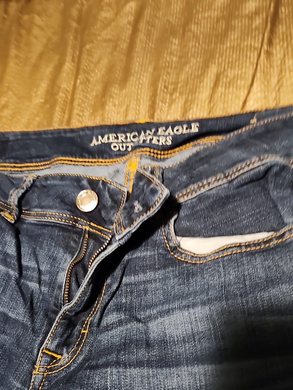 American Eagle Outfitters Dark Blue Bootcut Jeans with Gold Stitching